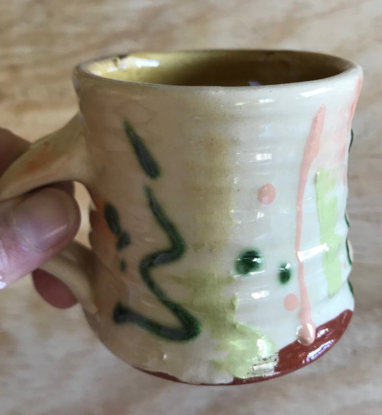 koffiekopje (oranje, groen, geel)